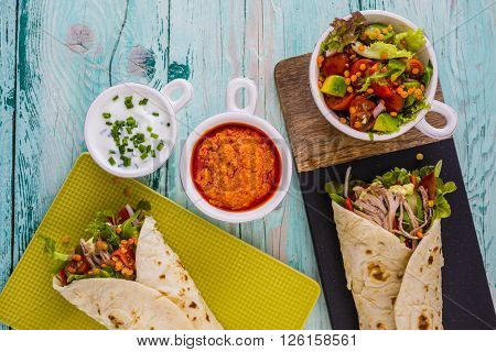 Tortilla with pulled pork, fresh vegetables
