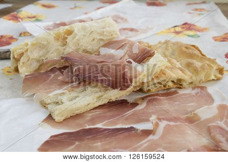 focaccia filled with serrano jamon cured ham as break lunch
