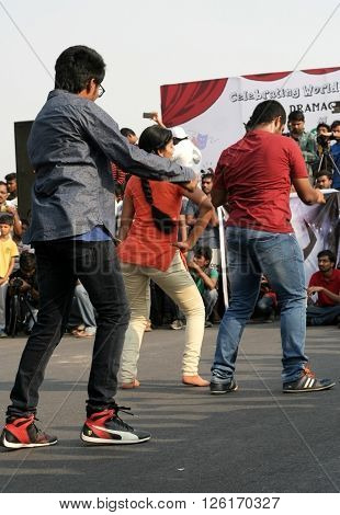 HYDERABAD,INDIA-MARCH 27:Indian young people dancing on open road event on Sunday morning, celebrating World theatre day on March 27,2016 in Hyderabad,India.