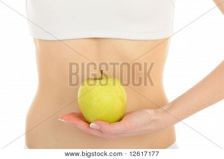 Donna con bel corpo tenendo una mela vicino alla vita sottile. Isolated On White Background