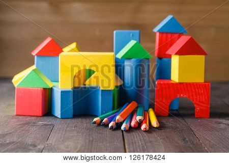 Different Colors Of Pencils Ontable With Building Blocks
