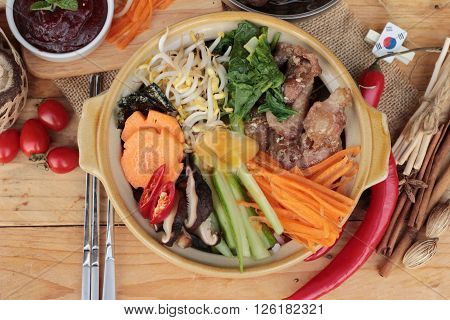 Bibimbap korean food is delicious placed on wood background