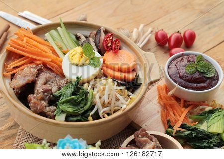 Bibimbap korean food is delicious placed on wood background
** Note: Visible grain at 100%, best at smaller sizes