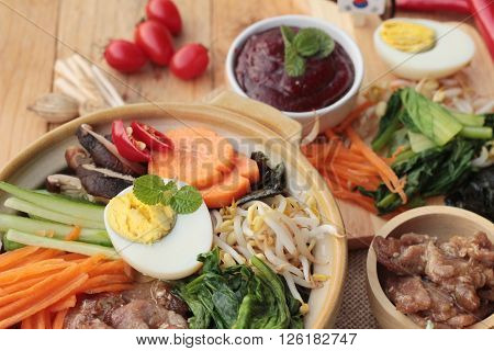 Bibimbap korean food is delicious placed on wood background
** Note: Visible grain at 100%, best at smaller sizes