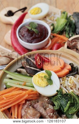 Bibimbap korean food is delicious placed on wood background
** Note: Visible grain at 100%, best at smaller sizes