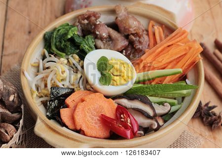 Bibimbap korean food is delicious placed on wood background