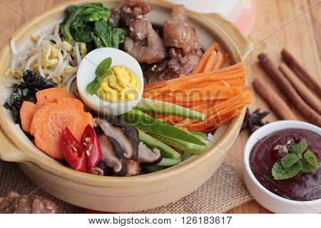 Bibimbap korean food is delicious placed on wood background