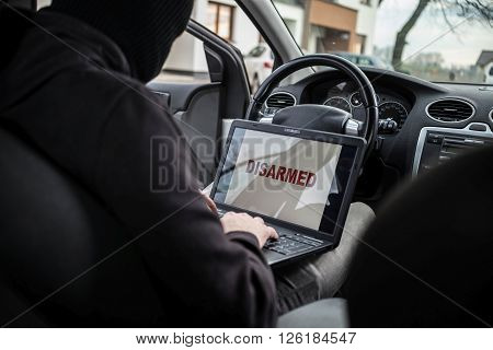 Car Thief Disarming Car Protections  With Laptop Computer