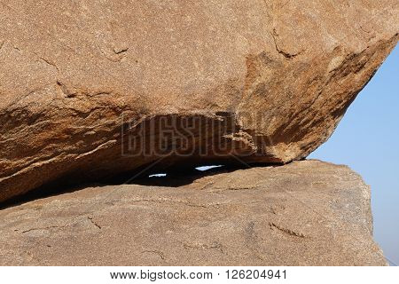 Stone boulders of Hampi in Kartanak's staff in India