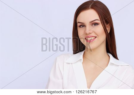 Portrait of happy business woman on grey background