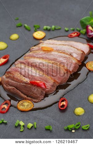 Pekin Duck With Vegetables Over Black Background