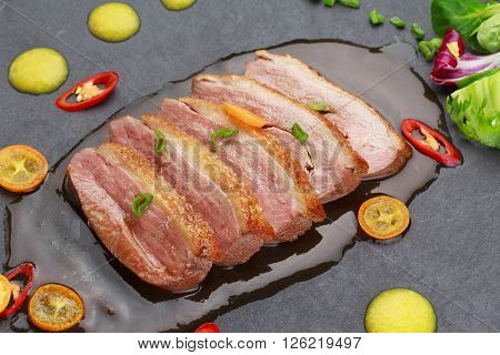 Pekin Duck With Vegetables Over Black Background