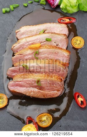 Pekin Duck With Vegetables Over Black Background