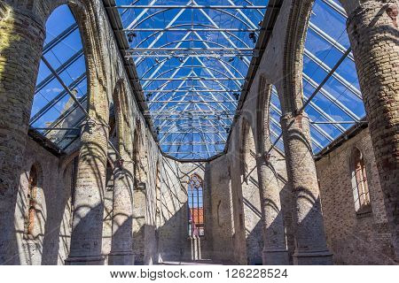 BOLSWARD, NETHERLANDS - APRIL 11, 2016: Ruins of the Broere church with modern glass roof in Bolsward Netherlands