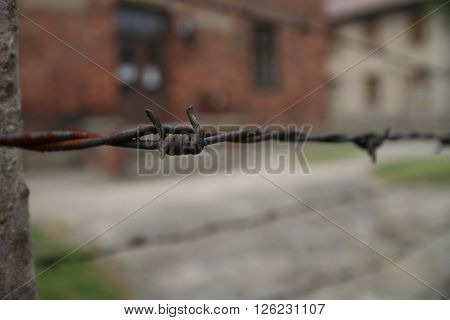 Oswiecim, Poland - May 09, 2015: Closeup View Of Electric Fence In Former Nazi Concentration Camp Au