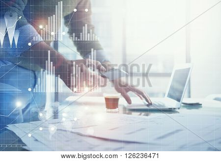 Business concept picture.Banker working new startup project modern office.Holding contemporary smartphone hands. Worldwide connection technology, stock exchanges graphics interface.