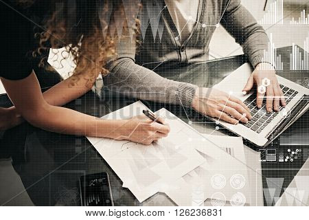 Business meeting concept. Businessmans crew working investment project modern office.Touching pad contemporary laptop. Worldwide connection technology, stock exchanges graphics interface.