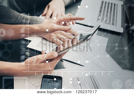 Photo female hands holding modern tablet and touching screen.Businessmans crew working new investment project  office.Using electronic devices. Graphics icons, stock exchanges interface.