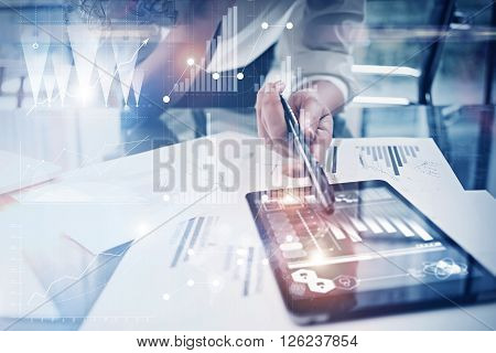 Photo working process. Finance director work new global project in worldwide bank office. Using modern tablet. Graphics icons, tax, stock exchanges interface.