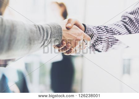 Business partnership meeting. Picture businessmans handshake. Successful businessmen handshaking after good deal. Horizontal, blurred
