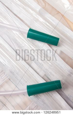 medical plastic catheters and syringes on table
