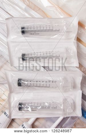 medical plastic catheters and syringes on table