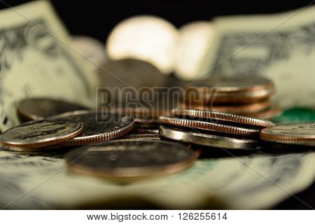 Savings thrift poverty taxes riches couch cushion money dollars dimes nichols and quarters