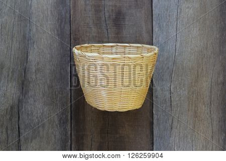 Basket weave of handicraft on old wooden for the design background.