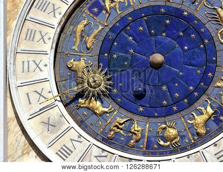 Detail from Saint Mark clocktower in the center of Venice with zodiac signs and roman numbers