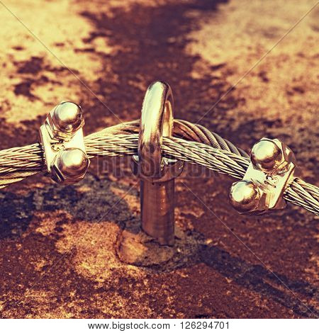 Eay Bolt In The Middle. Steel Anchor Bolt Eye In Rock. The Fixed  Steel Rope. Climbers Path Via Ferr