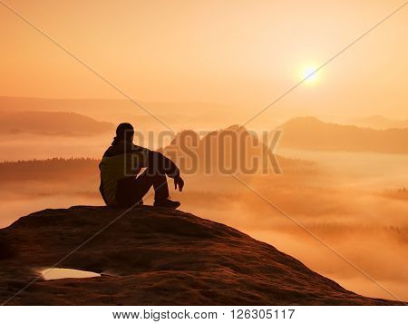 Spring Landscape. Hiker In Black On The Rocky Peak. Wonderful Daybreak In Mountains, Heavy Orange Mi