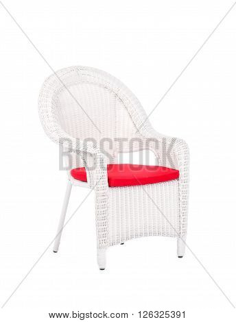 White wicker rattan chair isolated on a white background.