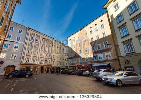 Salzburg Austria - January 07 2016: Painted facades of building on the Waag square at sunset time