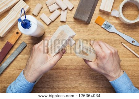 Woodworking workshop table top scene. Making of loose tenon joint.