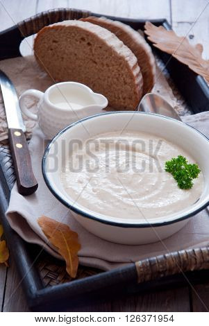 Autumn creamy soup on a wooden tray
** Note: Shallow depth of field