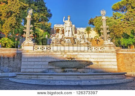 ROME ITALIA - AUGUST 27 2012: Rome between Tiber and Aniene Fountain in Piazza del Popolo in Rome in Italy. In the middle is she-wolf statue which is feeding Romulus and Remus