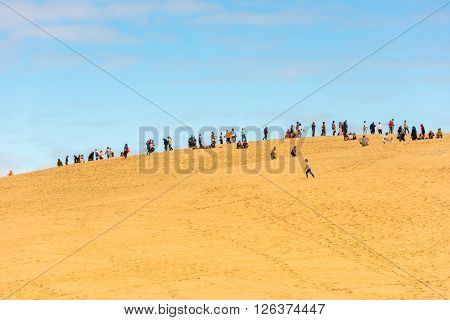 People Visiting The Highest Sand Dune Of Pyla In Europe