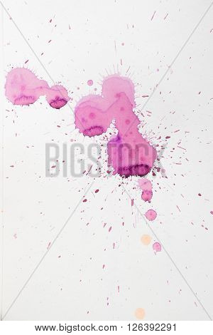colorful watercolor stains and streaks on a white background