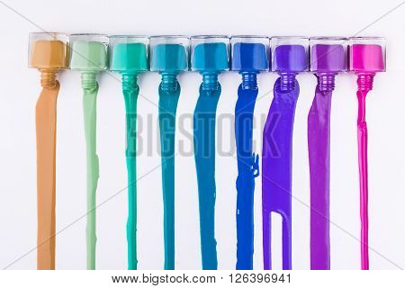 rainbow of nail polish isolated on a white background