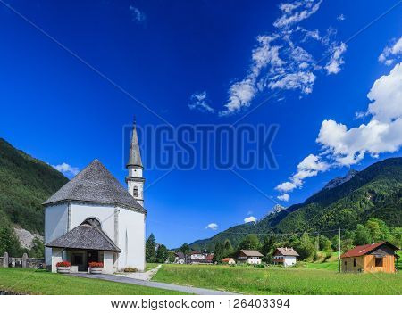 View to church in Dolomite mountains. Italian Alps. Panorama