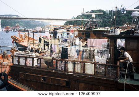 ABERDEEN / HONG KONG - CIRCA 1987: Families live on houseboats in the Aberdeen Floating Village in Hong Kong.