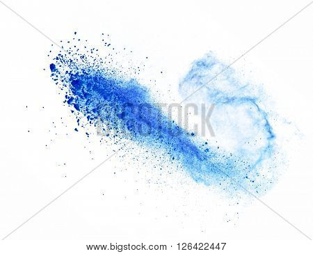 Explosion of blue powder on white background