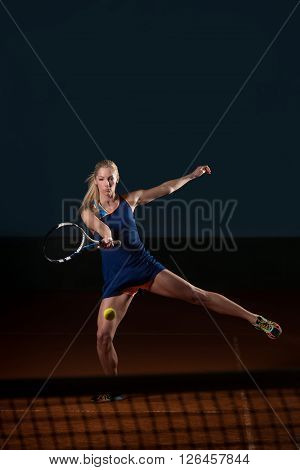 Tennis Player Hitting The Ball On Tennis Court