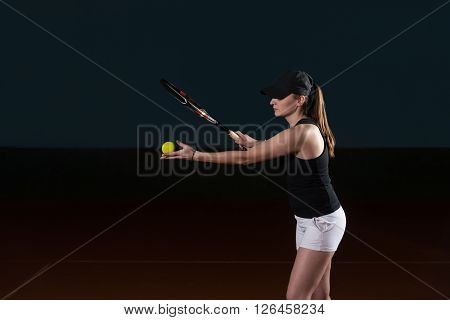 Young Woman Ready To Serves Toss Ball