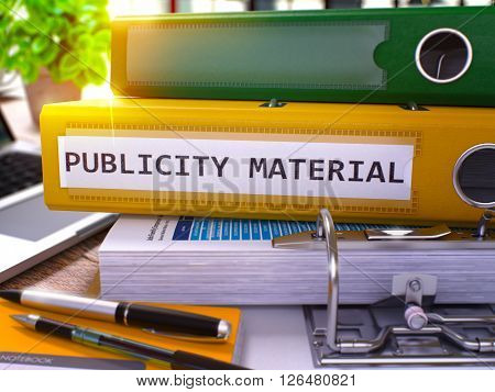 Publicity Material - Yellow Ring Binder on Office Desktop with Office Supplies and Modern Laptop. Publicity Material Business Concept on Blurred Background. 3D Render.