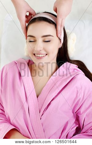 Spa Woman. Beautiful Girl. receiving facial massage