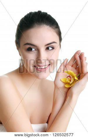 Young spa woman touching her face after beauty treatment