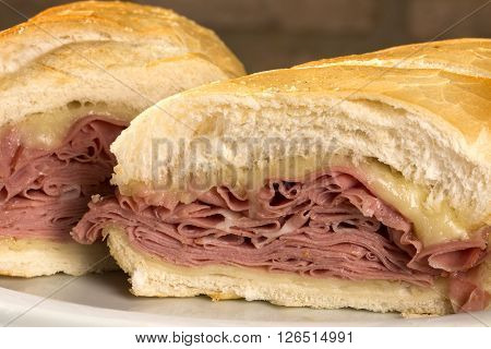 Mortadella traditional Italian sausage sandwich. Wood background