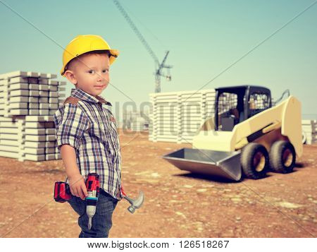 little handyman at construction site
