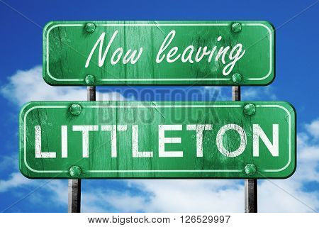 Now leaving littleton road sign with blue sky